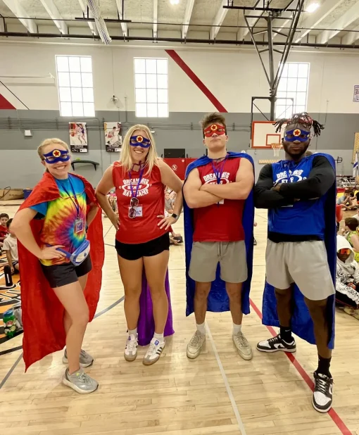 Adults dressed as superheroes